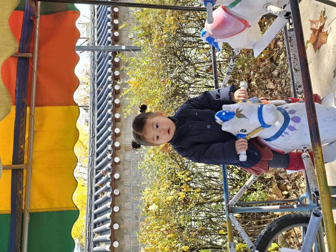 toddler posing in front of Starry Starry Night exhibition character board at children's museum entrance