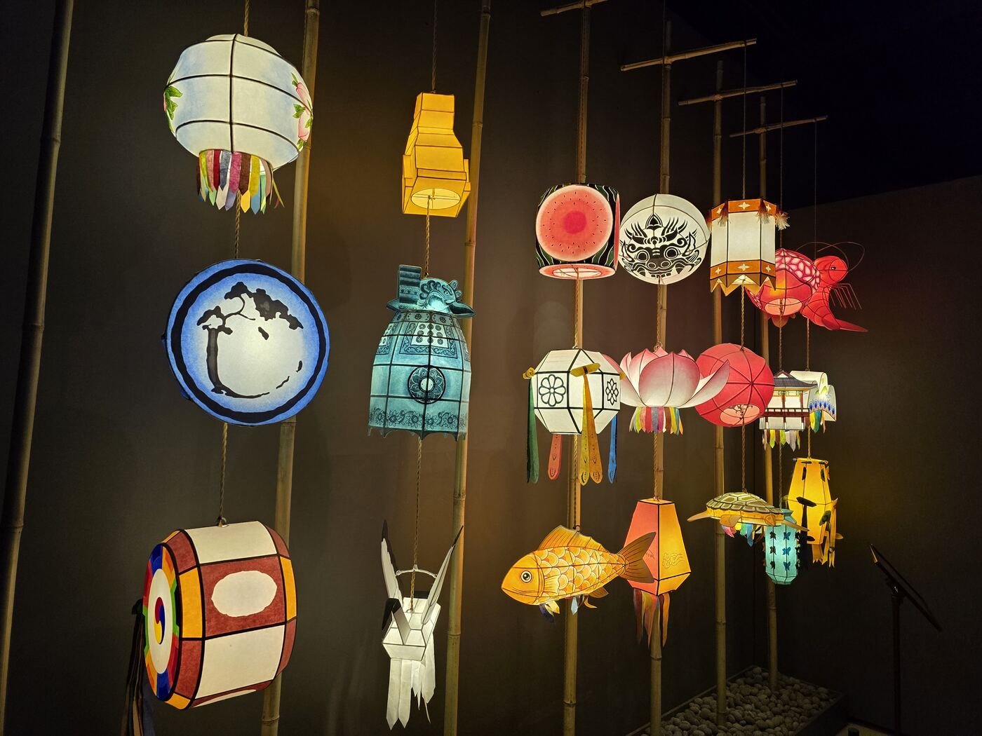 paper lanterns hanging display, fish and bird shapes, inside children's museum