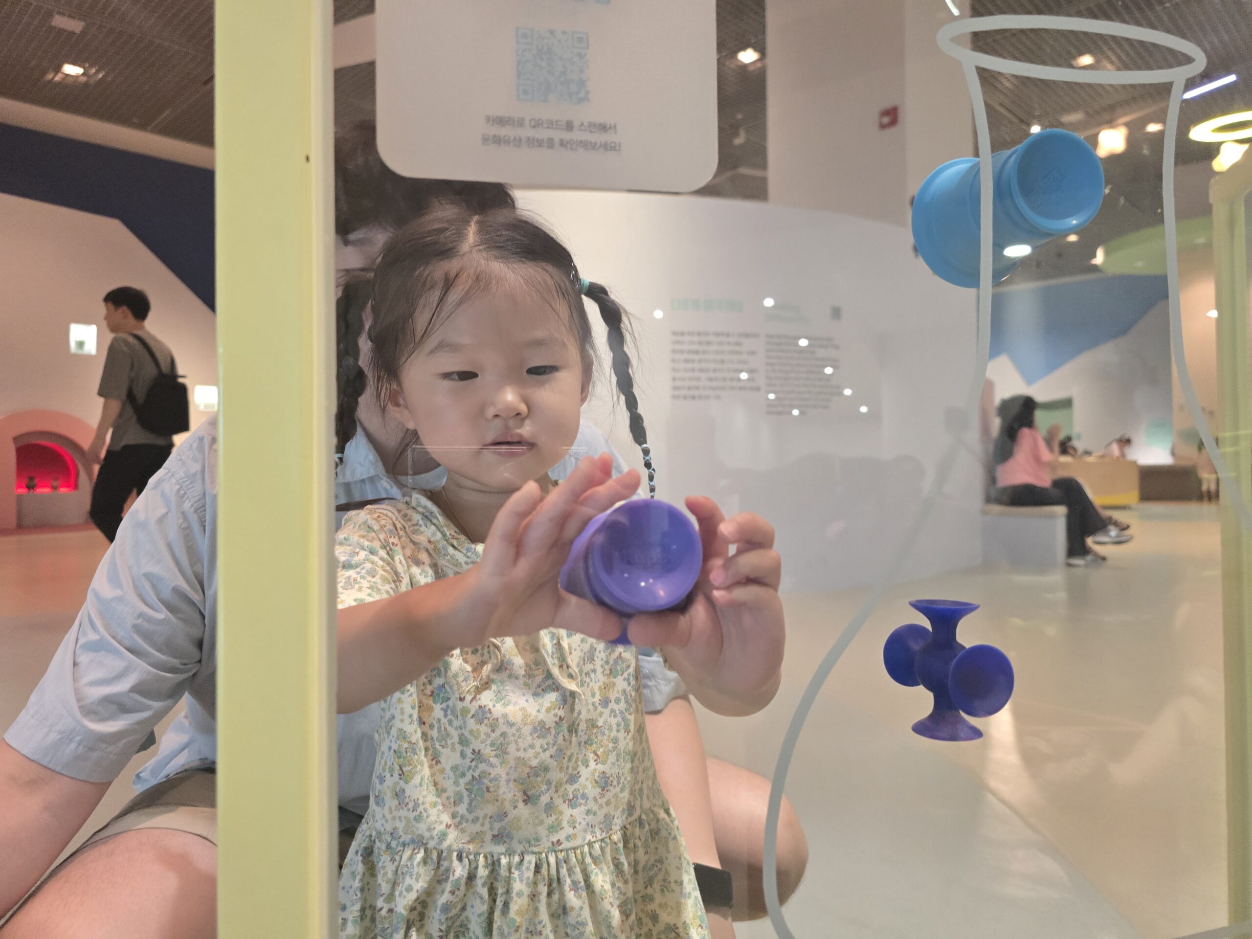 Observe Anew section — child exploring exhibit