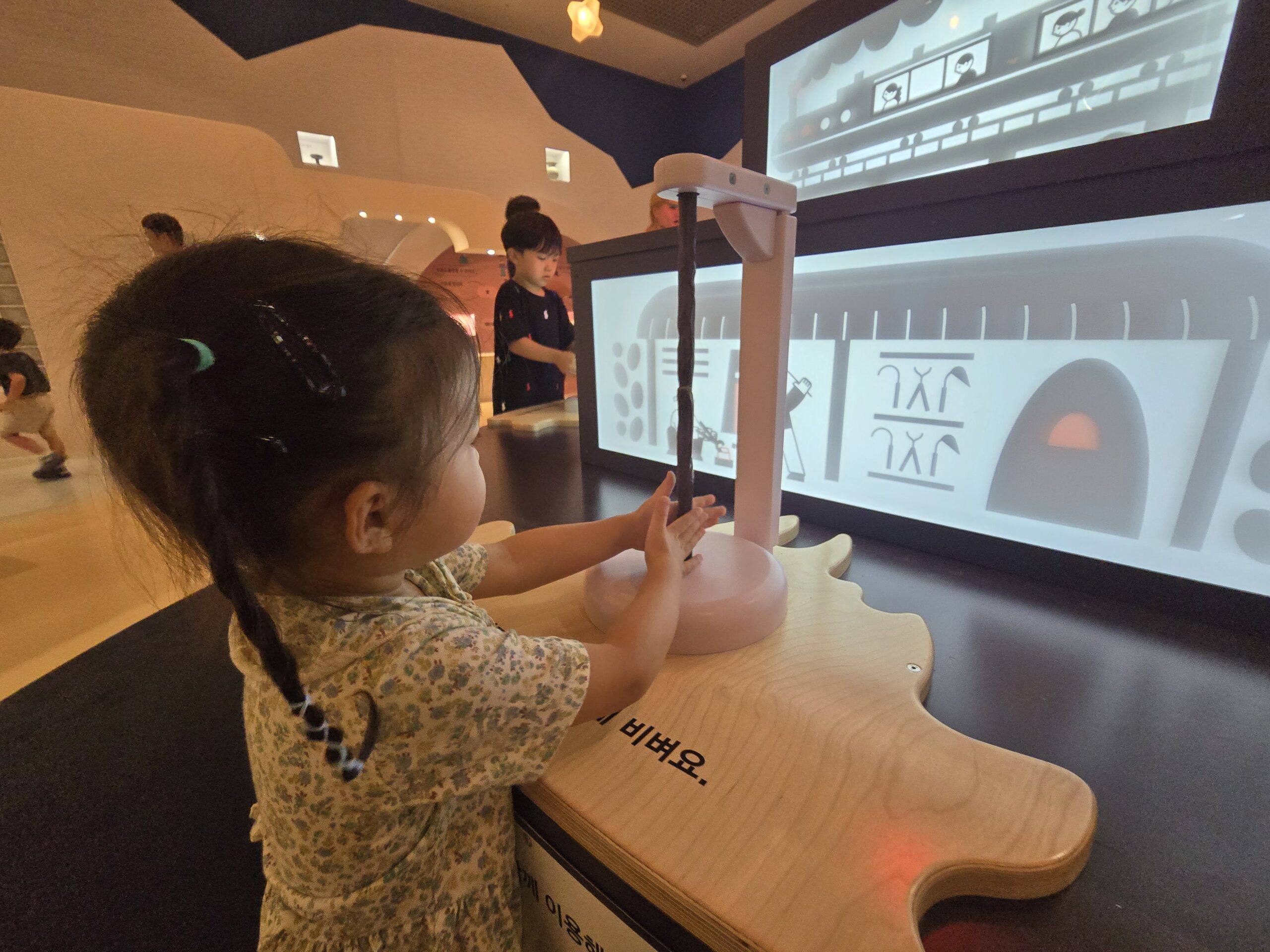 Think Differently — child using interactive display