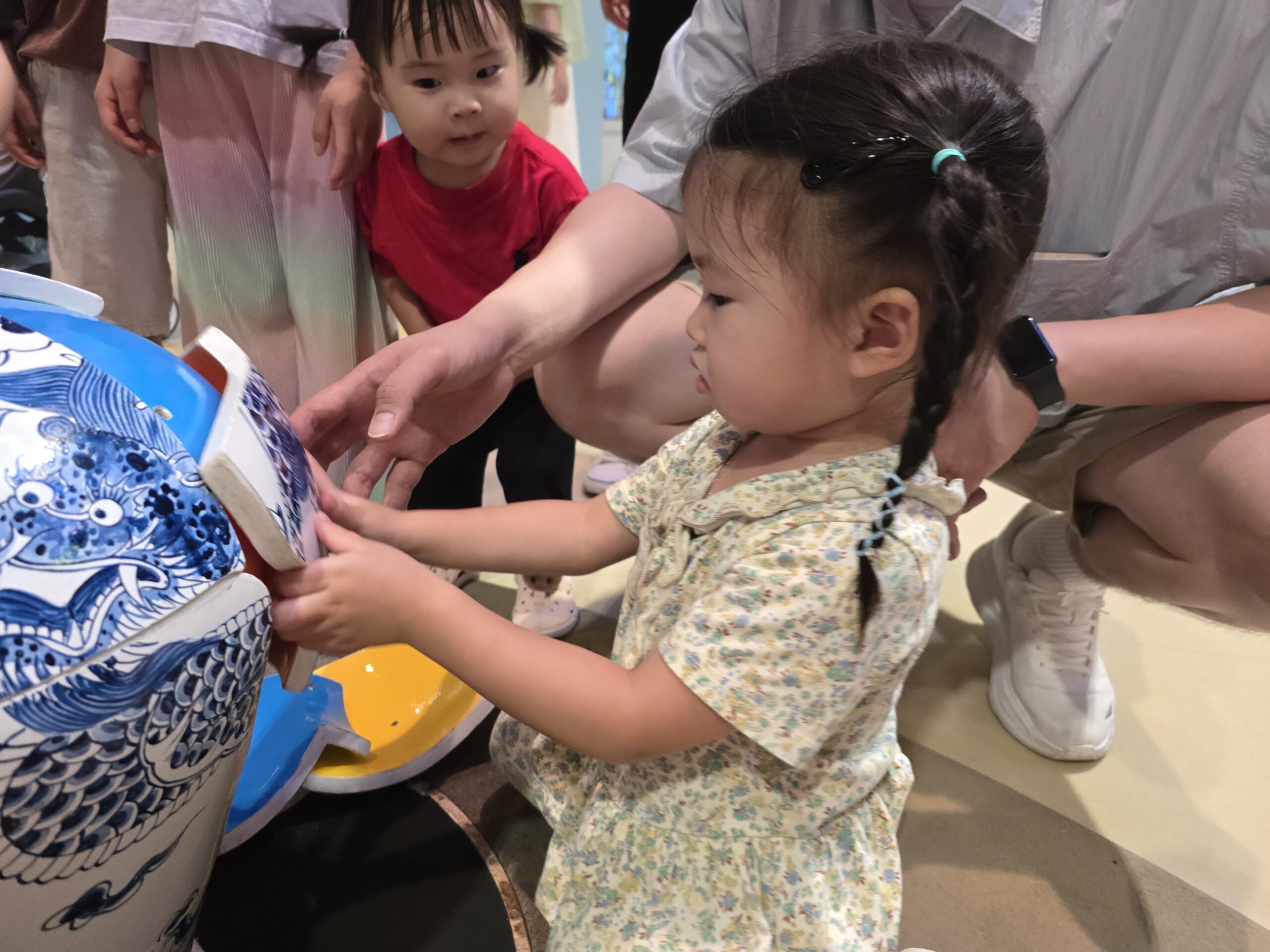 Think Differently — child assembling celadon puzzle