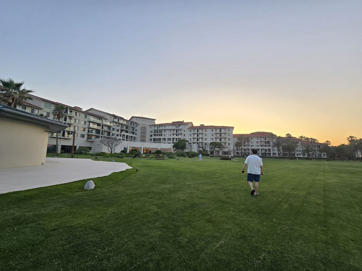 Walking through resort grounds at sunset