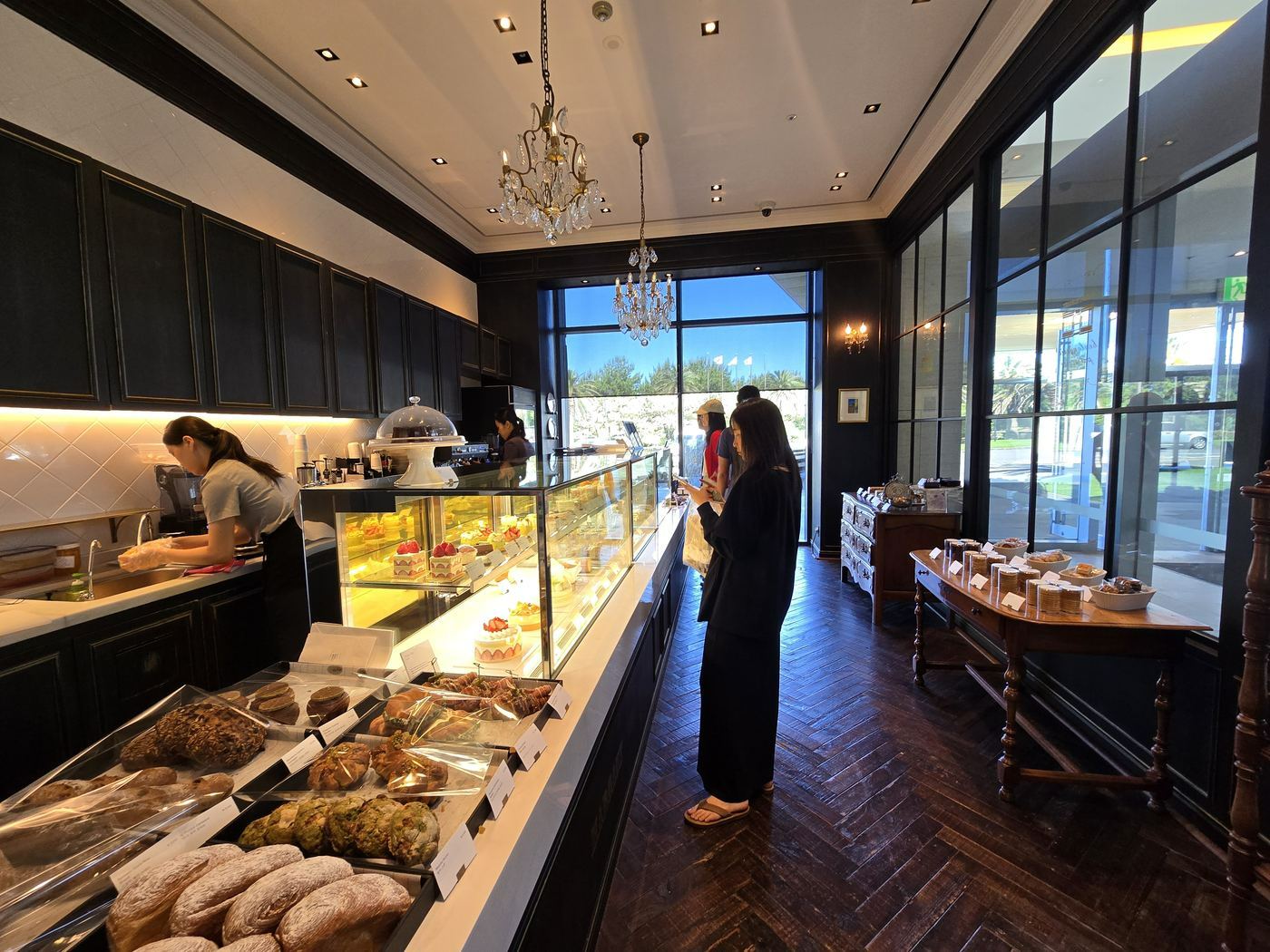 MARGAUX bakery interior with display case and chandelier
