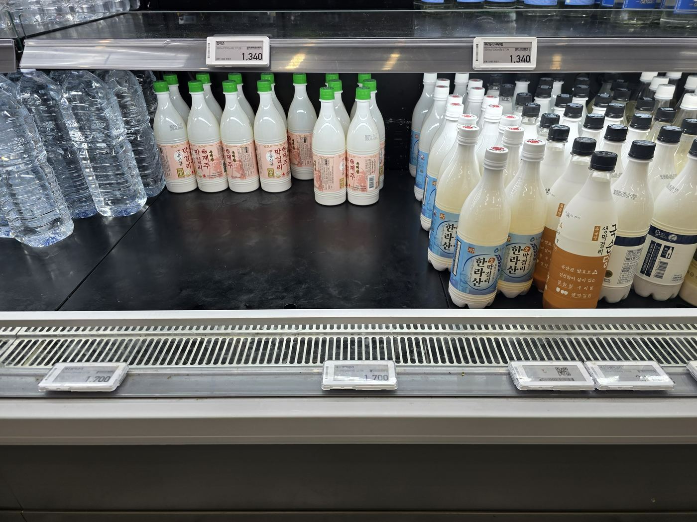 Refrigerated drinks section with makgeolli and Hallasan drinks