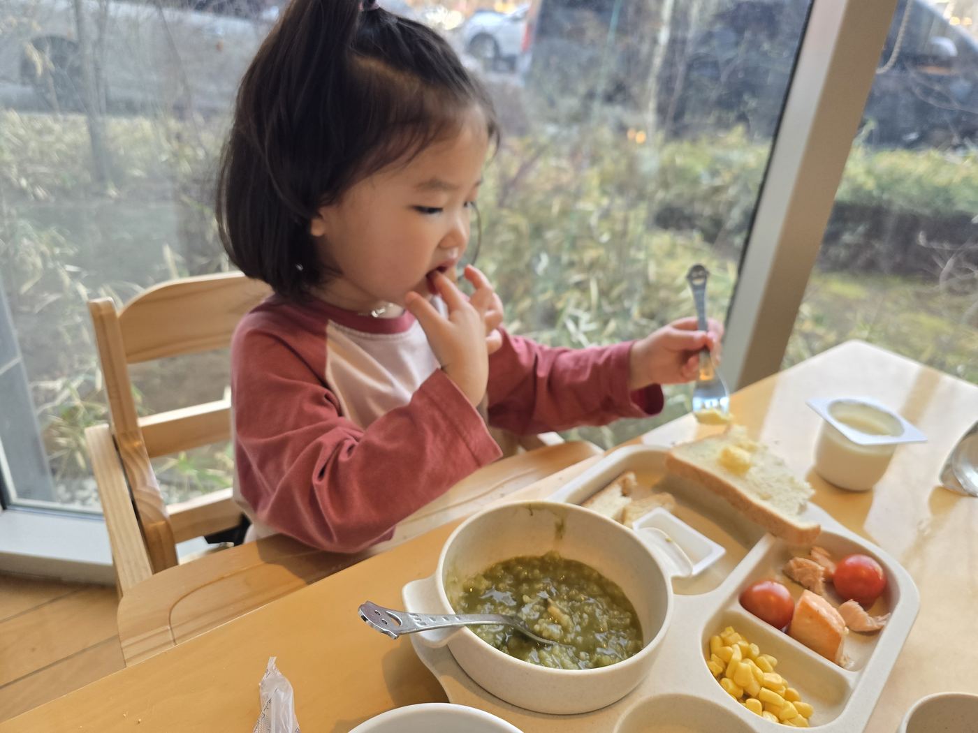 Our daughter at breakfast