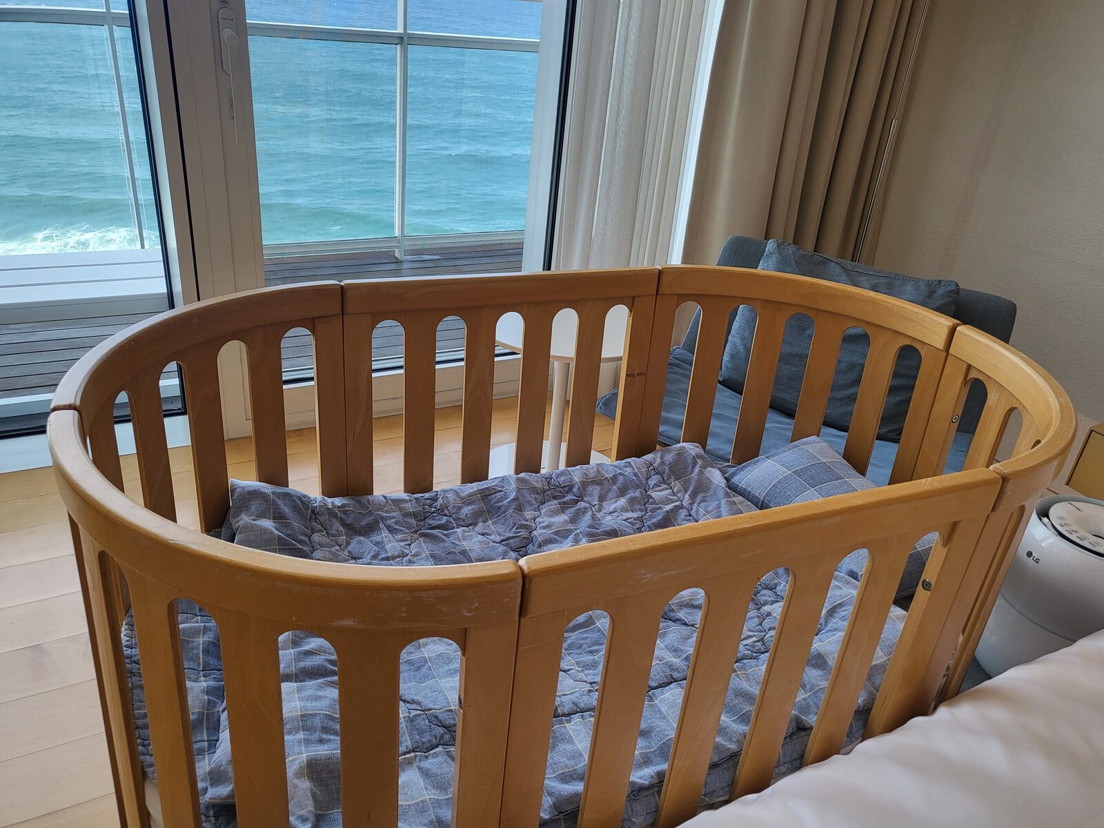 Round wooden baby crib overlooking the ocean at SEAMARQ Hotel Gangneung