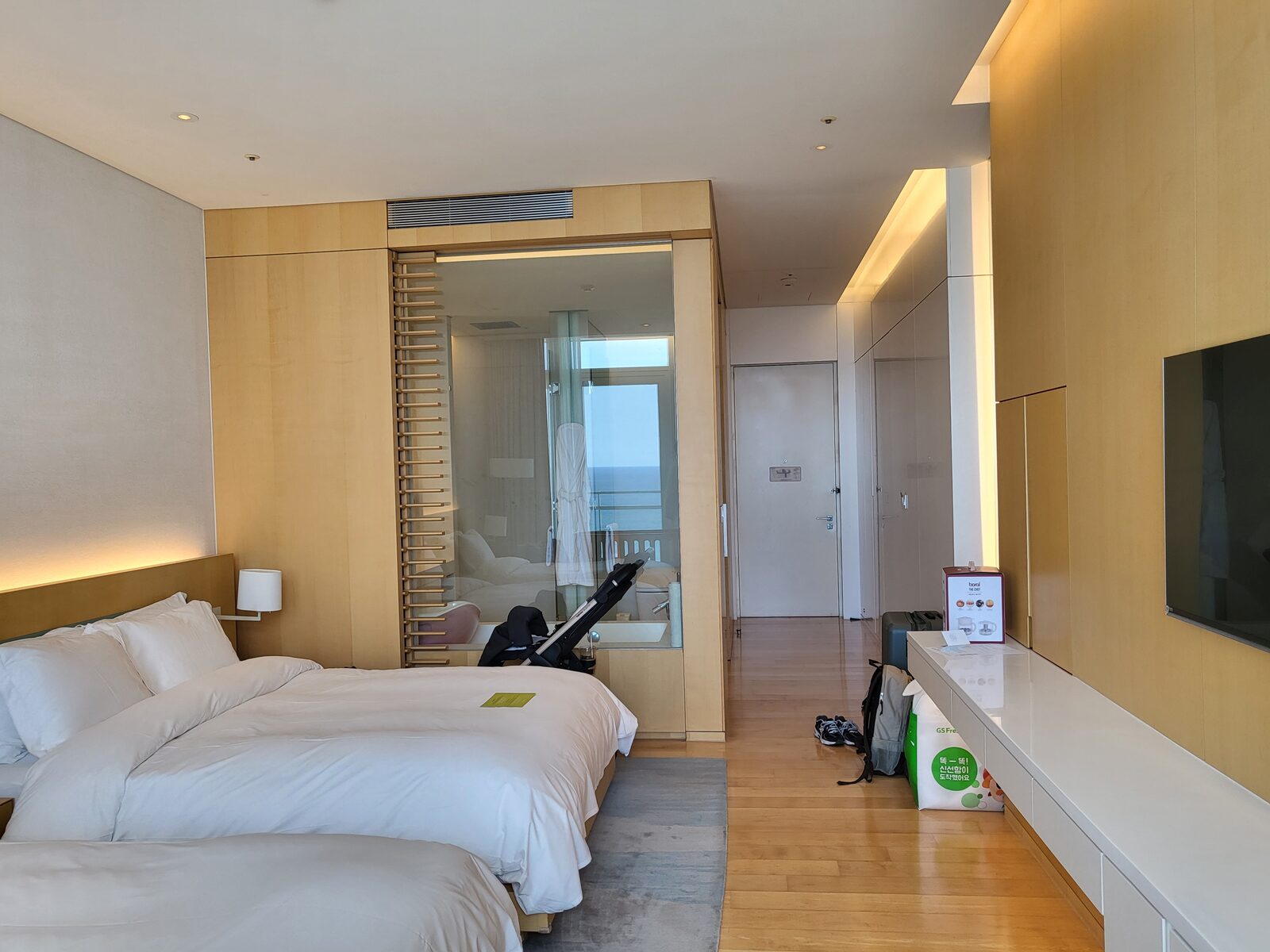 Ocean view room at SEAMARQ Hotel Gangneung with a baby stroller parked by the beds