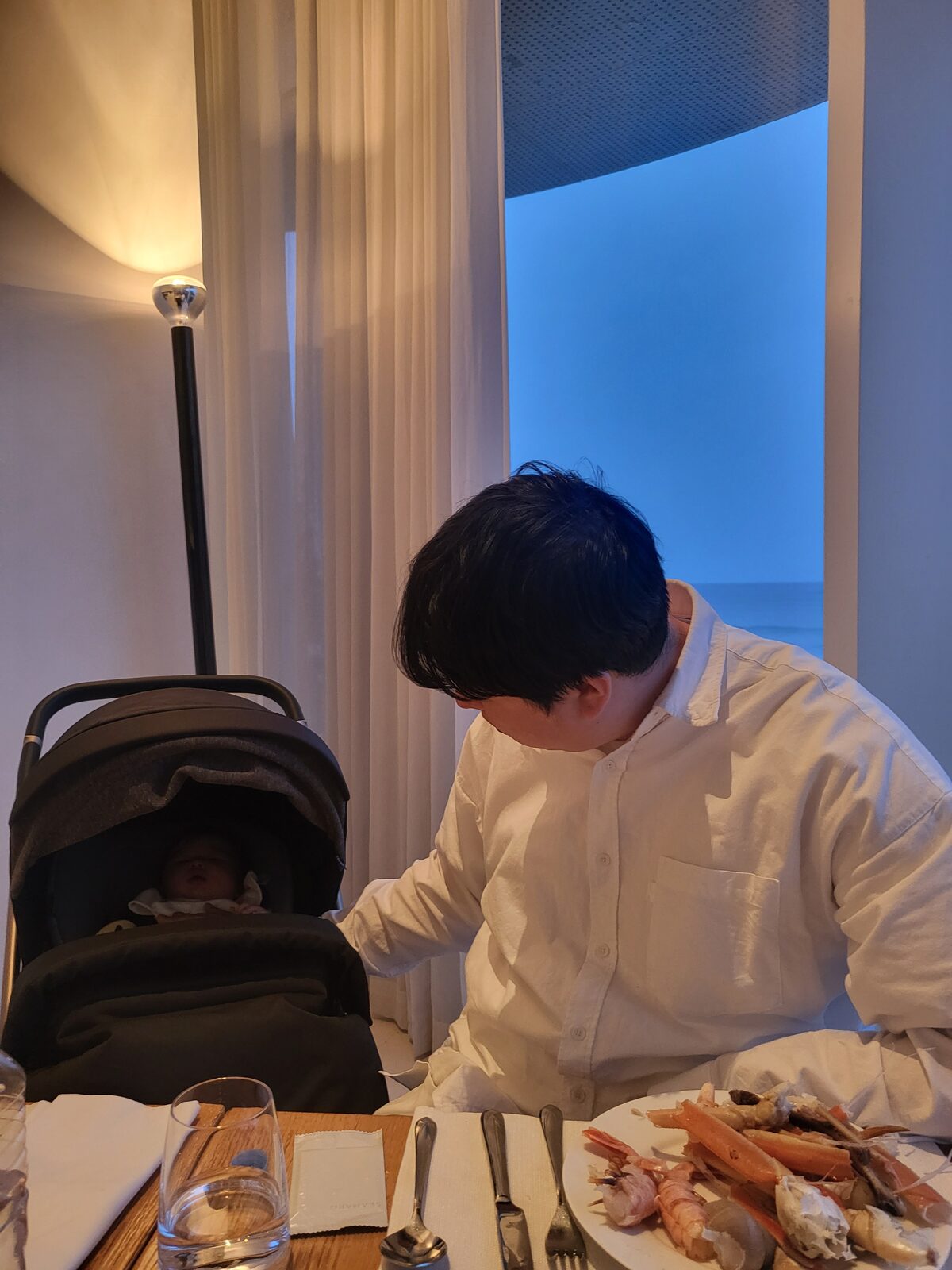 Family dinner at SEAMARQ Hotel Gangneung with the stroller pulled up to the table