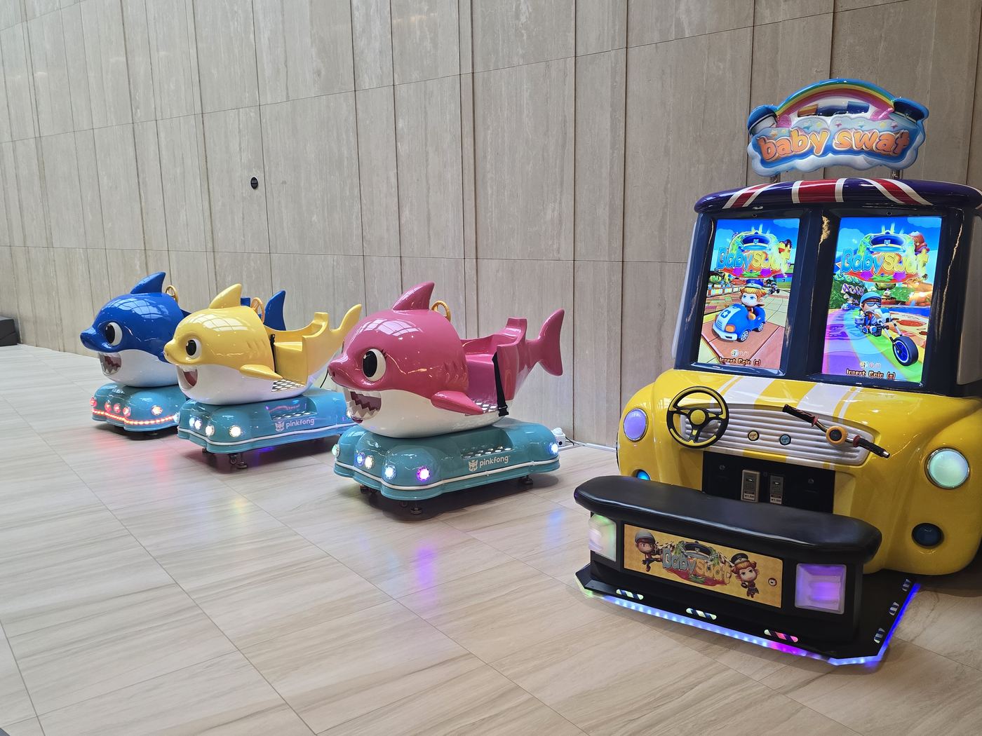 Baby Shark coin-operated ride-ons near the lobby