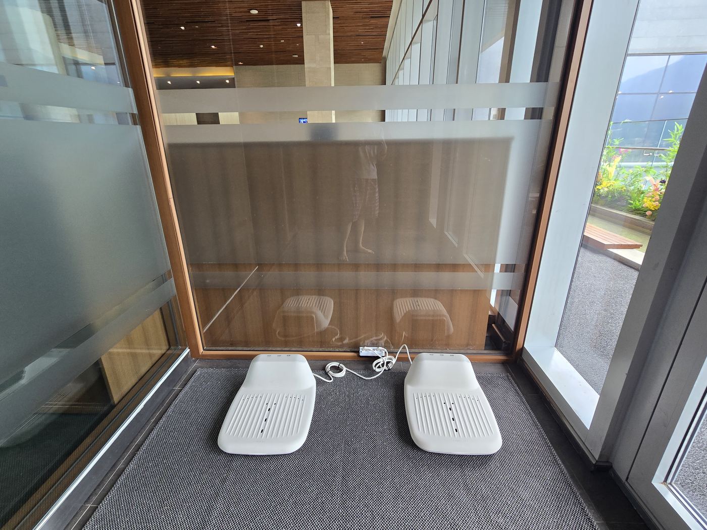 Foot massage footrests near the outdoor spa entrance