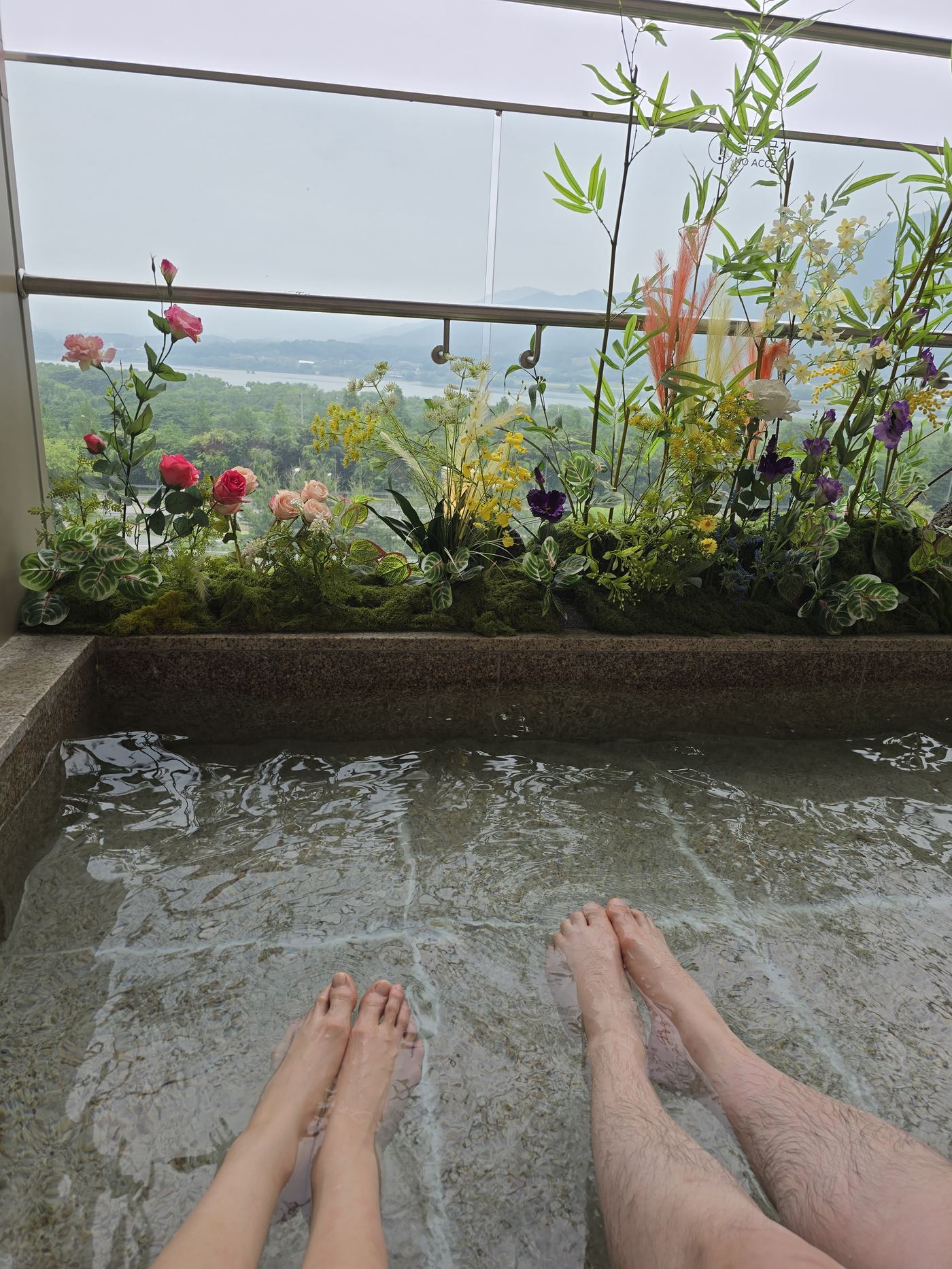 Feet soaking in the outdoor foot spa pool