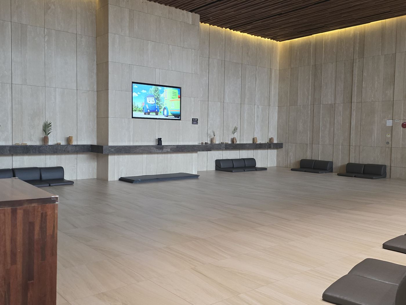 Large common lounge area with seating and TV