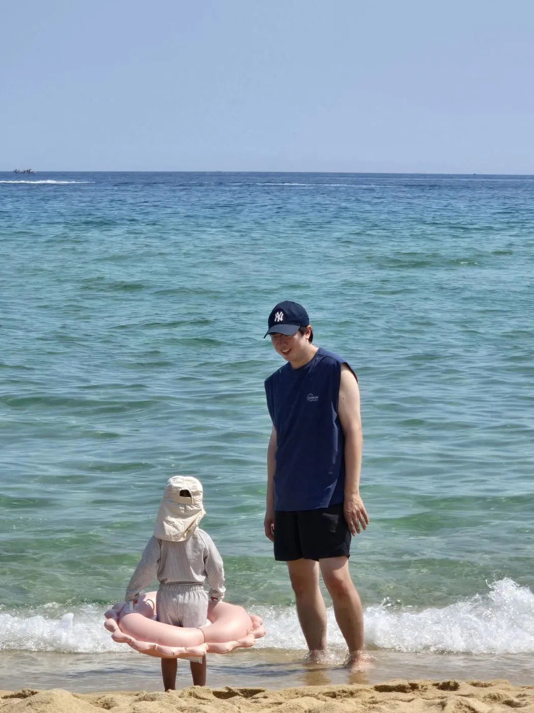 toddler playing waves Gyeongpo Beach Gangneung