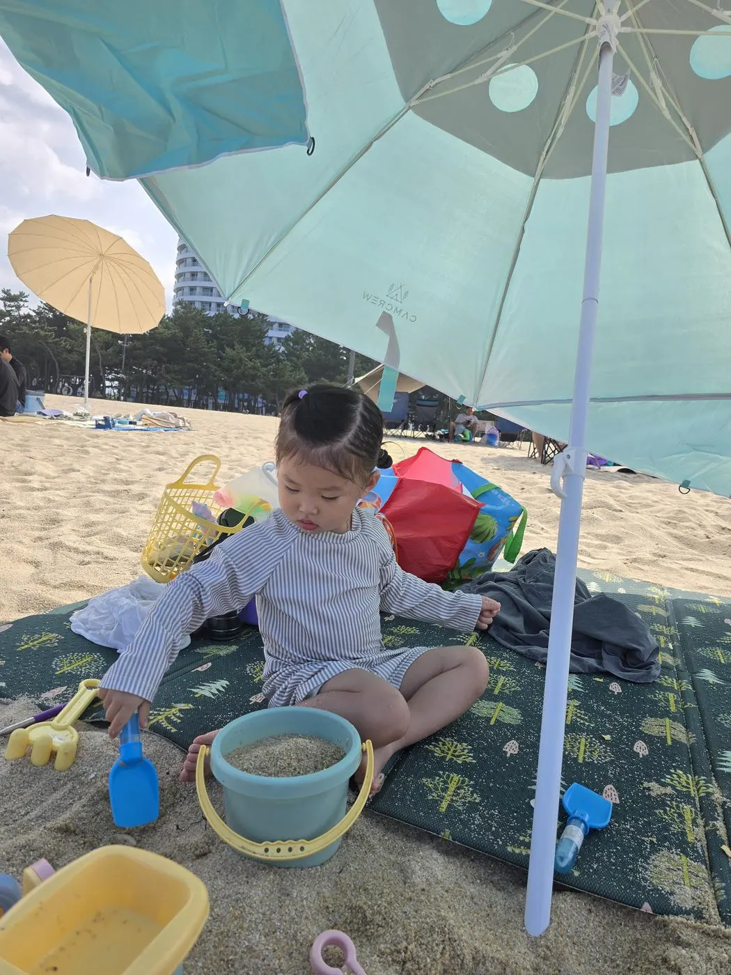 Toddler playing in the sand at Gyeongpo Beach