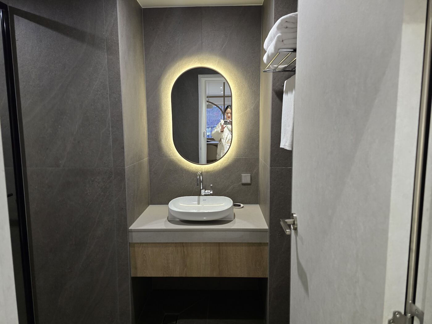 Hanwha Resort Seorak Sorano bathroom — backlit LED mirror and vessel sink