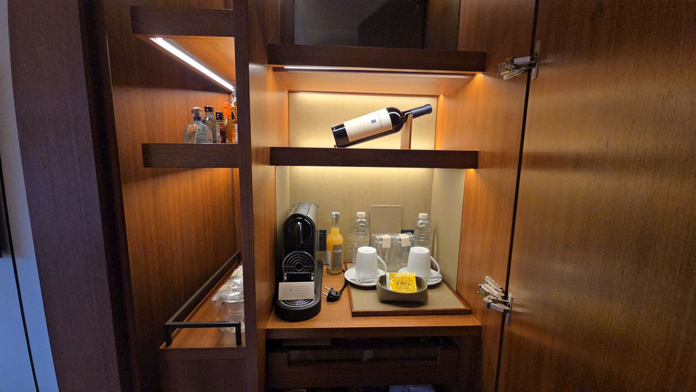 Minibar with Nespresso machine and tea set in the room