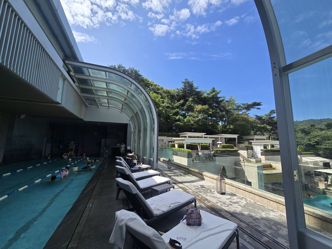 Hotel pool with Namsan Tower view during the day